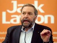 Tom Mulcair speaks in front of a Jack Layton sign in June 2011 in Montreal. Is the door closing on Mulcair and Layton's efforts to transform the NDP into a truly national political vehicle?