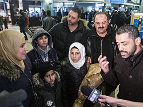 Members of the al Kadri family speak to the media through an interpreter on arrival in Edmonton Dec. 28.