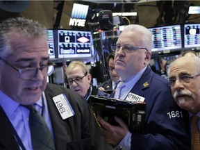 Traders work at the New York Stock Exchange which has seen a steady decline this year.