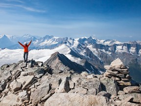 University of Alberta student Sarah Enright celebrates her arrival at the summit of Birthday Peak in the Purcell Mountains in B.C. in the summer of 2015.