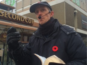 One of Edmonton's amplified street preachers spreads his message in front of the downtown public library.