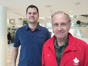 Herb Flewwelling, technical chair for the Aquatics Council of Edmonton, stands with council president Chris Nelson behind him.