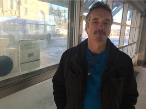 Rod Anderson waits for the bus on 100th Street downtown Jan. 24, 2016.