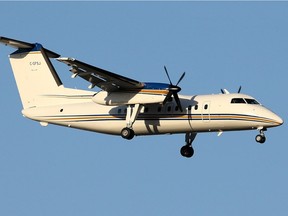 A Dash-8 plane is shown in the Alberta government handout photo.