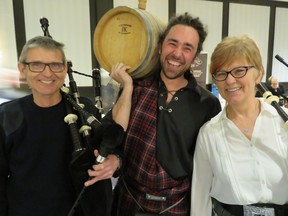 Andrew Walls (centre) carried a 20-litre cask of single malt scotch around the ballroom at the Delta South to launch the seventh annual Edmonton Whisky Festival. Marching with him were husband and wife bagpipers Kenny and Lori Blyth, who have been a team for 29 years. The event, organized by Vines of Riverbend wine and spirits merchants, raised about $50,000 for the MS Society.