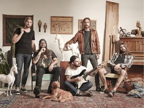 Royal Tusk, a group of Edmonton rockers featuring longtime friends Sandy MacKinnon, second from left, and Daniel Carriere, second from right.