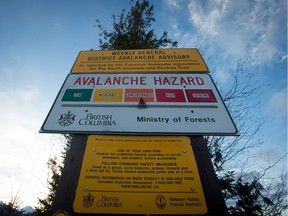 A January 30, 2016 photo of a sign showing an avalanche hazard warning to snowmobilers in the mountain of British Columbia.