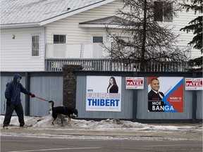 Ward 12 election signs on a fence near 38th Street and 38th Avenue, in Edmonton.