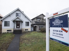 New federal mortgage rules came into effect on Feb. 15, 2016, increasing the down payment required on mortgages for homes in the $500,000-$1 million range. This sold sign is in front of a Vancouver home in February 2016.