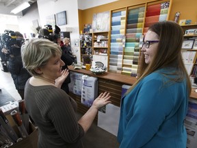 The Paint SPOT art store owner Kim Fjordbotten (left) gives Alberta's Minister of Labour, Christina Gray (right), a tour after a press conference where Gray encouraged employers to apply for the Summer Temporary Employment program in Edmonton, Alta., on Friday February 26, 2016. Fjordbotten says her art store will use the program to hire two summer students.