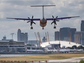 A passenger plane comes into land at ondon City Airport on August 6, 2015 in London, England.