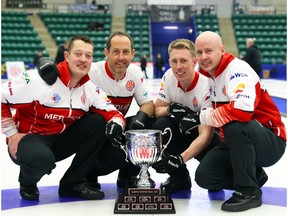 Ben Hebert, Brent Laing, Marc Kennedy and Kevin Koe of Team Koe celebrate winning their third consecutive provincial championship Sunday in Camrose.
