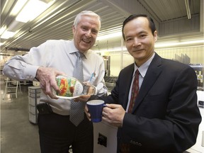 BioNeutra senior vice-president and former Edmonton mayor Bill Smith, left, and BioNeutra president and CEO Jianhua Zhu at BioNeutra's production plant, 9608 25 Ave., in Edmonton on Feb. 23, 2016. The company has developed a prebiotic low-calorie sweetener called VitaFiber.