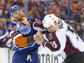 Colorado Avalanche's Cody McLeod fights it out with Edmonton Oilers' Zack Kassian during first period NHL action in Edmonton, on Feb. 20, 2016.