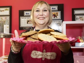 Baker Kathy Leskow holds a plate of fresh made cookies at Confetti Sweets in Sherwood Park, on Feb. 21, 2016.