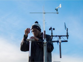 David Isilebo was among a group of 24 University of Alberta students who took to the roof of the Tory Building on Tuesday, Feb. 9, 2016, to set up equipment as part of their environmental instrumentation class.