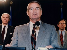 Alberta Premier Don Getty, Treasurer Dick Johnston, left, and Energy Minister Rick Orman, right, at a news conference at the Alberta Legislature in Edmonton, Alta., Feb. 21, 1990. Don Getty, the Canadian Football League star quarterback who served as Alberta's 11th premier, has died at the age of 82.