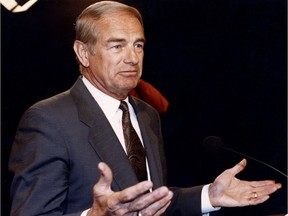 lberta premier Don Getty gestures at the Alberta legislature during a news conference on Feb. 7, 1992.