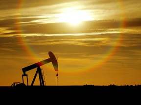 An oil well pumps against the setting sun near Drumheller. Alberta's grazing lease program is under review.