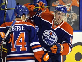 Edmonton Oilers' Connor McDavid (R) and Jordan Eberle celebrate goal against the Columbus Blue Jackets during NHL action at Rexall Place in Edmonton February 2, 2016.