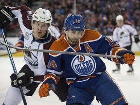Jordan Eberle of the Edmonton Oilers, skates off Nick Holden of the Colorado Avalanche at Rexall Place in Edmonton on Feb. 20, 2016.