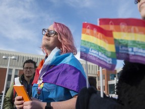 Dylan Chevalier, a Grade 11 student at St. Joseph High School and the students' union vice-president, was told by a teacher to remove his rainbow flag cape at a school procession Thursday. Dylan and about 20 supporters rallied outside the school Friday at lunchtime to support LGBQT students.