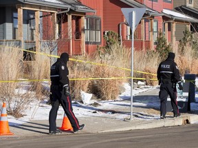 Police tape off crime scene that included a pool of blood, at the corner of Chappelle Road and Chappelle Drive on February 21, 2016 in Edmonton.  (Greg Southam)