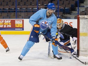 Oilers forward Benoit Pouliot, shown here at practice in December, was demoted from the top line after some bad penalties in Tuesday`s game against the  Ducks.