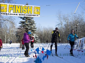 Edmonton Journal reporter Otiena Ellwand and her Learn to Loppet ski instructor, Don Mallon, finish the 31-kilometre event together at the 27th annual Canadian Birkebeiner Ski Festival on Saturday, Feb. 14, 2015.