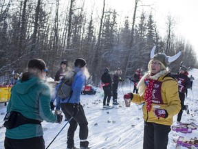 Volunteers for the 2015  Canadian Birkebeiner race hand out snacks and warm drinks at one of the many pit stops.