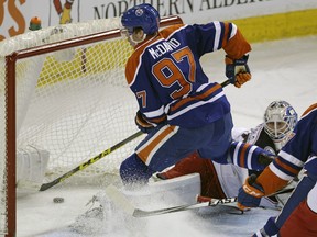 Edmonton Oiler Connor McDavid scores on Columbus Blue Jackets goalie Joonas Korpisalo during second-period NHL action in Edmonton on February 2, 2016.