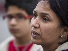 Gurpreet Sidhu speaks to media in 2014 by the Rabbit Hill Road and Hodgson Boulevard intersection where her husband, Paramjeet Sidhu, was struck and killed by a vehicle on Oct. 5, 2014. An arrest in the case was announced Thursday.