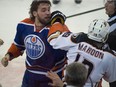 Patrick Maroon (19) refuses to fight Luke Gazdic (20) as the Edmonton Oilers play the Anaheim Ducks at Rexall place in Edmonton on  Dec. 31, 2015.