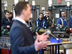 NAIT millwright students listen to Deron Bilous, Alberta minister of economic development and trade, announce an incentive program for the petrochemical industry.