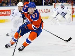 Connor McDavid (97) of the Edmonton Oilers goes up against the Toronto Maple Leafs at Rexall Place in Edmonton, Alta. on Feb. 11, 2016.