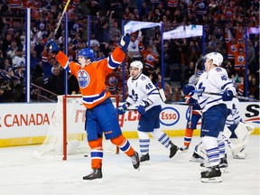 Connor McDavid (97) of the Edmonton Oilers celebrates the teams fourth goal against the Toronto Maple Leafs at Rexall Place in Edmonton, Alta. on Feb. 11, 2016.