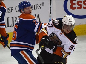 Iiro Pakarinen and Ducks forward David Perron  battle in front of the net during Tuesday's game at Rexall Place.