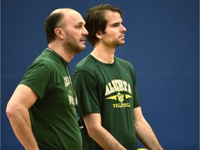 Alberta Golden Bears men's volleyball team associate coach, Brock Davidiuk (R) with head coach Terry Danyluk , oversees practice at the Saville Centre in Edmonton on Wednesday.