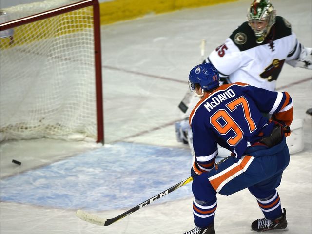 Edmonton Oilers Connor McDavid (97) scores on Minnesota Wild goalie Darcy Kuemper (35) during first period NHL action at Rexall Place in Edmonton, February 18, 2016.