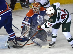 Edmonton Oilers goalie Cam Talbot (33) about to get scored on by Minnesota Wild Mikael Granlund (64) during NHL action at Rexall Place in Edmonton, February 18, 2016.
