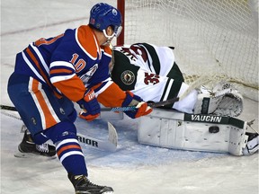 On a break away Edmonton Oilers Nail Yakupov (10) can't get the puck over the pad of Minnesota Wild goalie Darcy Kuemper (35) during second period NHL action at Rexall Place in Edmonton, February 18, 2016.