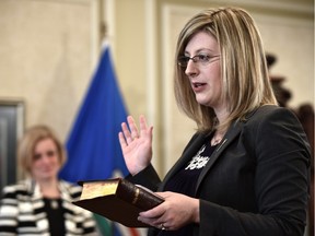 Stephanie McLean was sworn in Tuesday as minister of service Alberta and minister of the status of women as Premier Rachel Notley looked on.