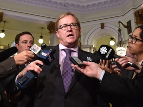 Minister of Education David Eggen talking to the media after meeting with leaders of the Catholic community about the department's new gender-identity guidelines for Alberta schools in Edmonton, February 8, 2016.