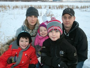 The Tomlinson family - from left, Tristen, 7, Morgann, Taiya, 3, Tysen, 10 and Brian - photographed near Poplar Lake in January 2016.