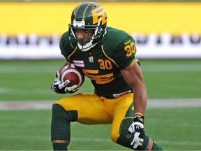 Running back John White, shown here in action in 2014, was re-signed by the Edmonton Eskimos on Tuesday.