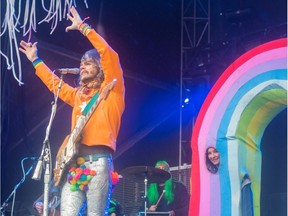 The Flaming Lips perform Sunday afternoon in the rain during  Sonic Boom Music Festival at Borden Park in Edmonton on September 6, 2015.