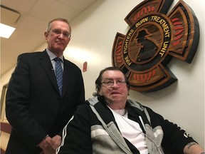 Dr. Edward Tredget (left) poses with patient Al Pombert at the University of Alberta Hospital on Tuesday to highlight the dangers of smoking while on oxygen therapy.