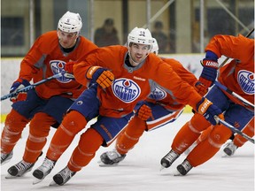 Edmonton Oilers Justin Schultz (19) races alongside Mark Fayne (5) and Andrej Sekera (2) during a practice held at Leduc Recreation Centre in Leduc, Alta., on Wednesday February 24, 2016. Photo by Ian Kucerak