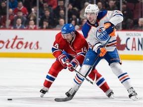 Montreal Canadiens forward Tomas Plekanec, left, and Edmonton Oilers defenceman Justin Schultz battled for the puck at Montreal's Bell Centre on Feb. 6, 2016.