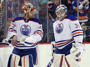 Edmonton Oilers goalie Cam Talbot, left, comes in to replace Anders Nilsson against the New York Islanders on Feb. 7, 2016 in New York.